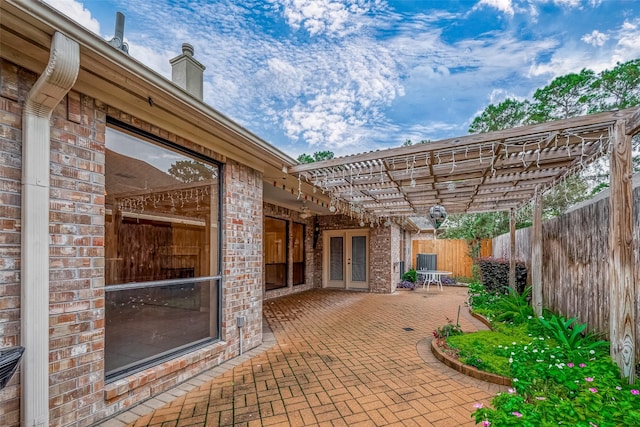 3110 Meadow Oak Dr, Houston, TX 77068 - fenced backyard with a pergola, a patio, and french doors
