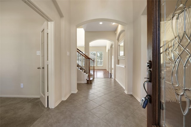 19815 Stanton Lake Dr, Cypress, TX 77433 - entryway with arched walkways, baseboards, and stairs