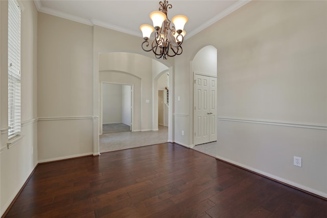 19815 Stanton Lake Dr, Cypress, TX 77433 - unfurnished room featuring arched walkways, a chandelier, wood-type flooring, crown molding, and baseboards