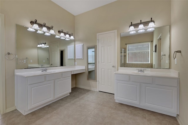 19815 Stanton Lake Dr, Cypress, TX 77433 - full bath with two vanities, tile patterned flooring, and baseboards