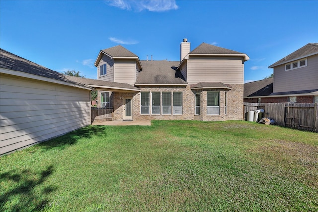 19815 Stanton Lake Dr, Cypress, TX 77433 - rear view of property with brick siding, a chimney, and a patio area