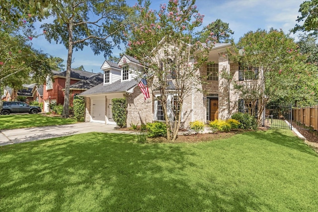 view of front of home featuring a garage and a front yard