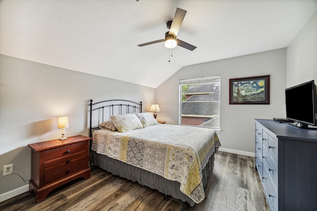 bedroom featuring ceiling fan, dark hardwood / wood-style flooring, and lofted ceiling