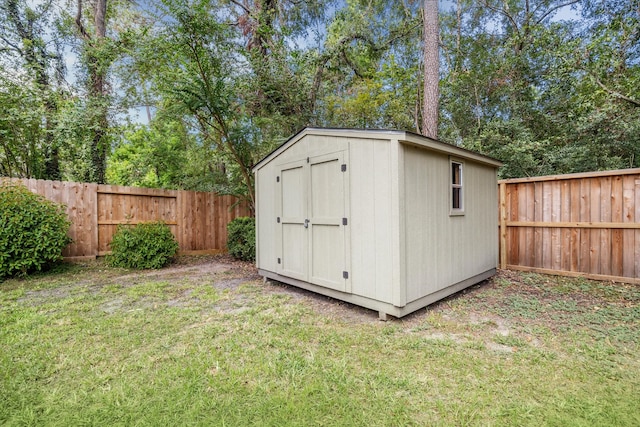 view of outbuilding with a lawn