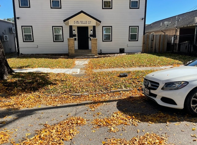 view of front of house with fence