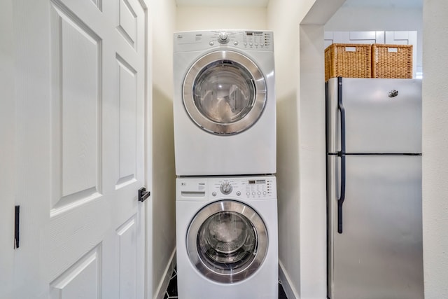 washroom with stacked washer and clothes dryer