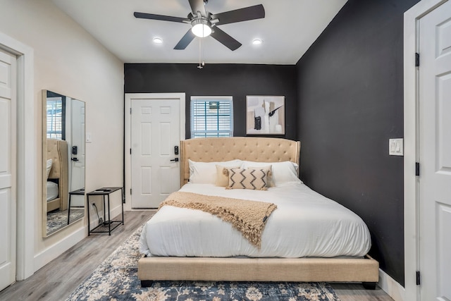 bedroom featuring ceiling fan and light hardwood / wood-style floors