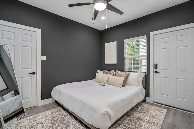 bedroom featuring ceiling fan and light wood-type flooring