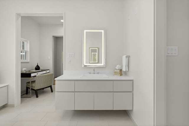 bathroom featuring tile patterned flooring and vanity