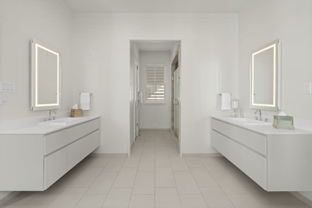 bathroom featuring tile patterned floors, vanity, and an enclosed shower