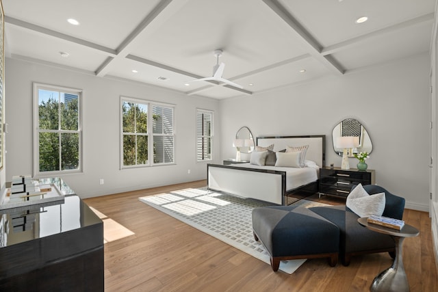 bedroom featuring beam ceiling, ceiling fan, light hardwood / wood-style flooring, and coffered ceiling