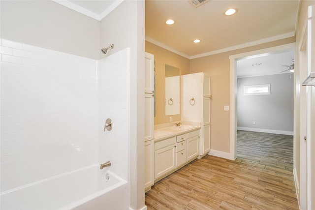 6609 Greenhurst St, Houston, TX 77091 - bathroom featuring vanity, wood finished floors, shower / tub combination, crown molding, and recessed lighting
