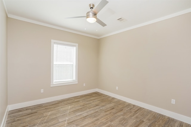 spare room featuring crown molding, light hardwood / wood-style flooring, and ceiling fan