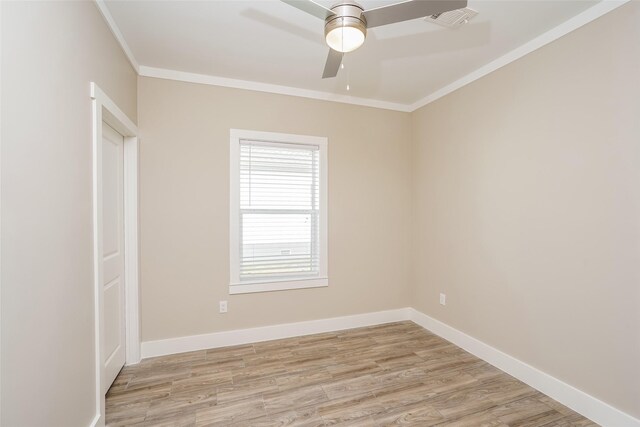 6609 Greenhurst St, Houston, TX 77091 - spare room featuring crown molding, a ceiling fan, light wood finished floors, and baseboards
