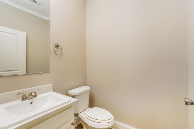 6609 Greenhurst St, Houston, TX 77091 - bathroom with vanity, toilet, ornamental molding, and baseboards