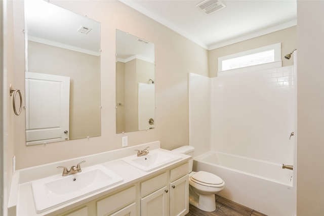 full bathroom with shower / bathtub combination, vanity, crown molding, hardwood / wood-style flooring, and toilet