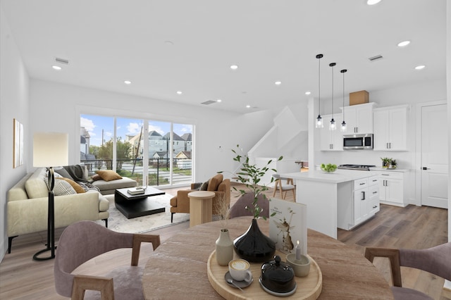 dining area with light hardwood / wood-style floors