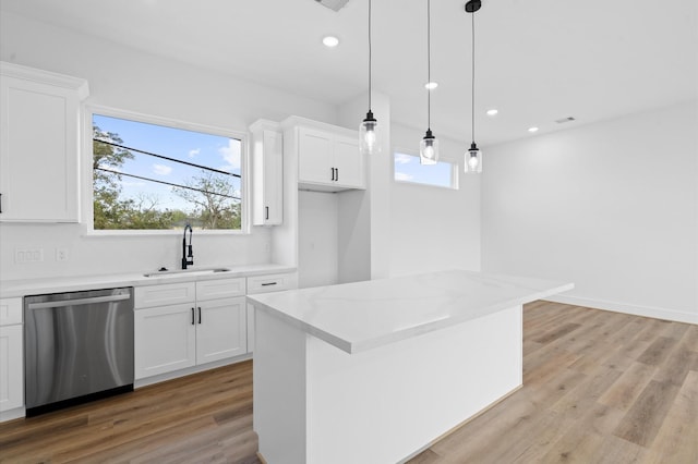4124 Bucks St, Houston, TX 77020 - kitchen featuring dishwasher, white cabinetry, recessed lighting, light wood finished floors, and hanging light fixtures
