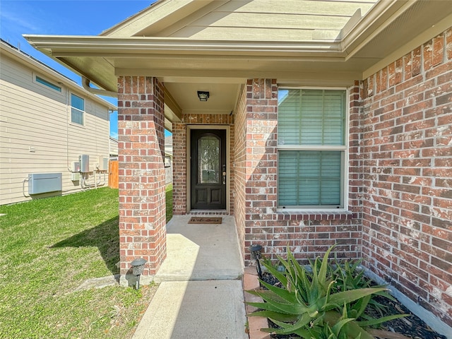 doorway to property with a yard