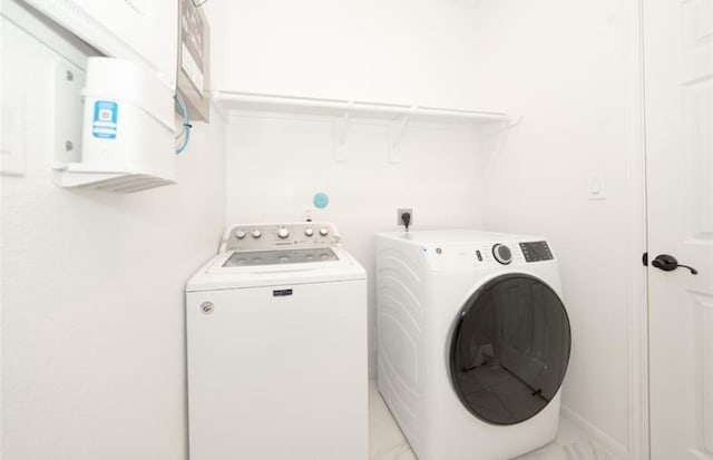 laundry area with washer and clothes dryer