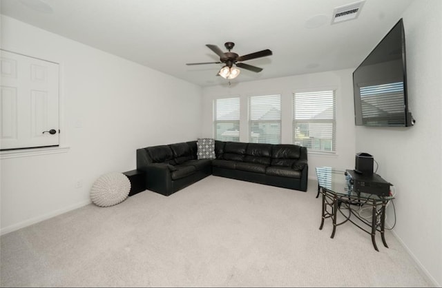 carpeted living room featuring ceiling fan