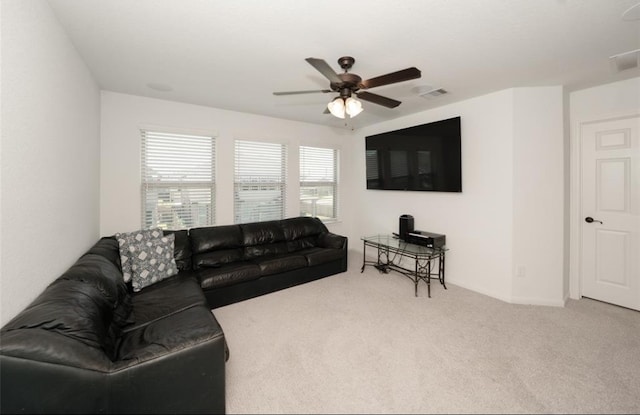 living room with ceiling fan and carpet floors