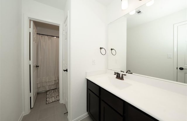 bathroom featuring tile patterned floors and vanity