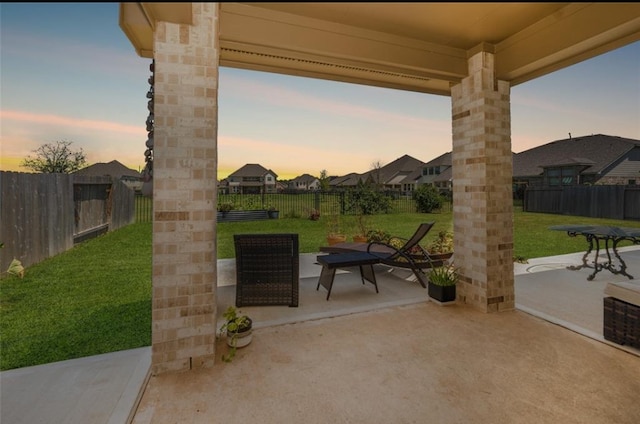 patio terrace at dusk with a yard