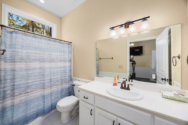 bathroom with vanity, toilet, and tile patterned flooring