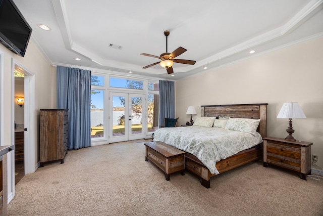 bedroom with ornamental molding, access to outside, french doors, ceiling fan, and a raised ceiling