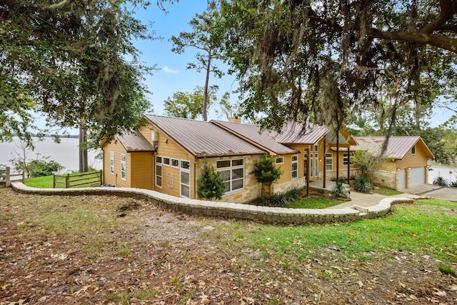 view of front of house featuring a water view