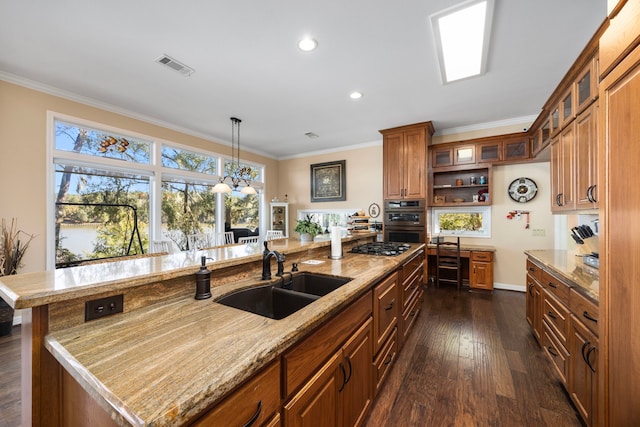 kitchen with a center island with sink, sink, dark wood-type flooring, and crown molding