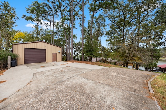 view of side of home featuring an outbuilding and a garage