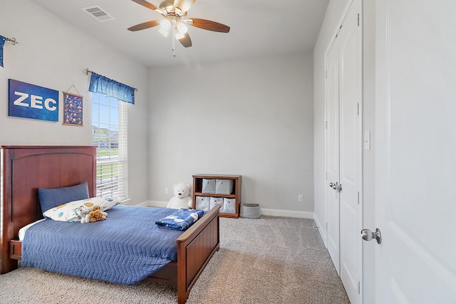 bedroom with ceiling fan and light carpet