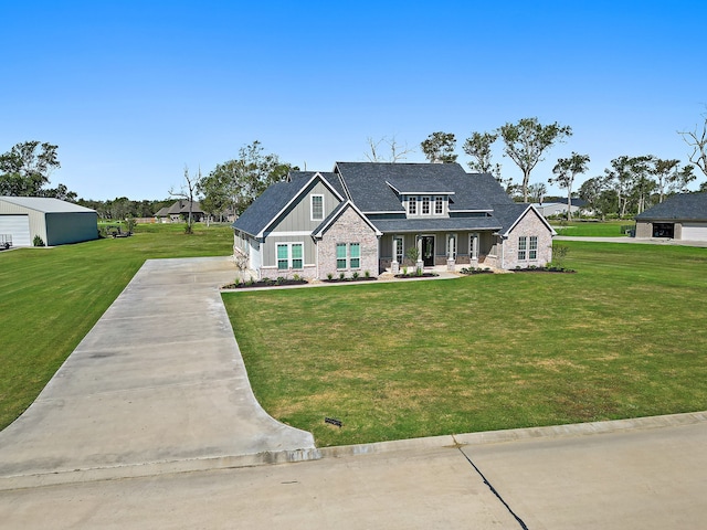 view of front of home featuring covered porch and a front yard