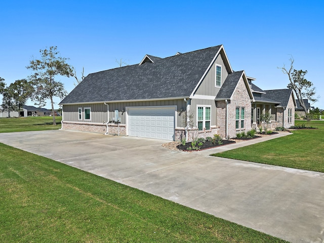 view of front of property featuring a garage and a front yard