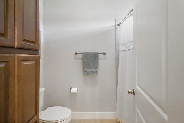 bathroom with tile patterned floors and toilet