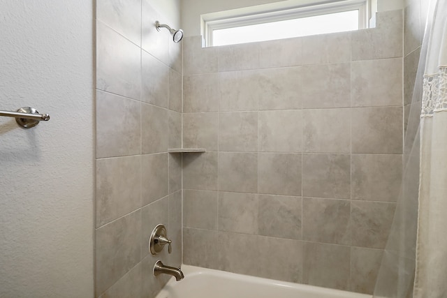 bathroom with shower / bath combo