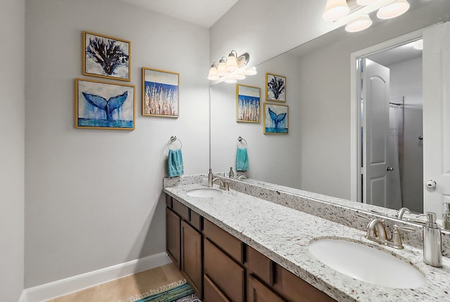 bathroom with tile patterned flooring and vanity