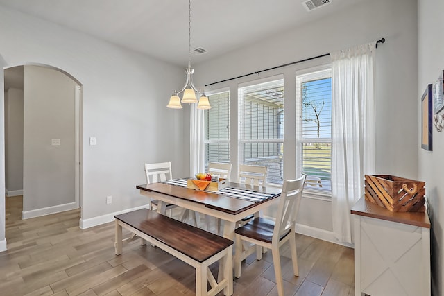 dining space with light hardwood / wood-style flooring