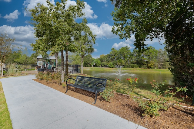 surrounding community featuring a water view