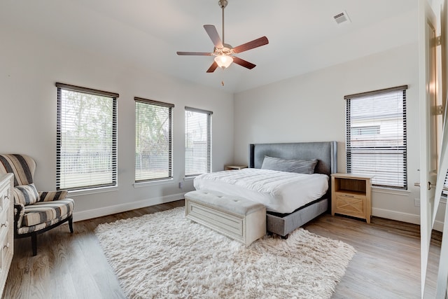 bedroom featuring hardwood / wood-style flooring and ceiling fan