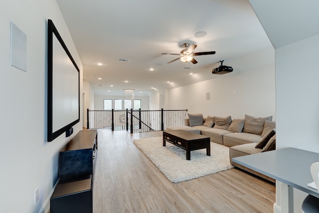 living room featuring ceiling fan and hardwood / wood-style flooring