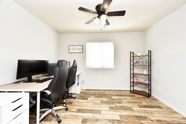 office featuring ceiling fan and light hardwood / wood-style floors