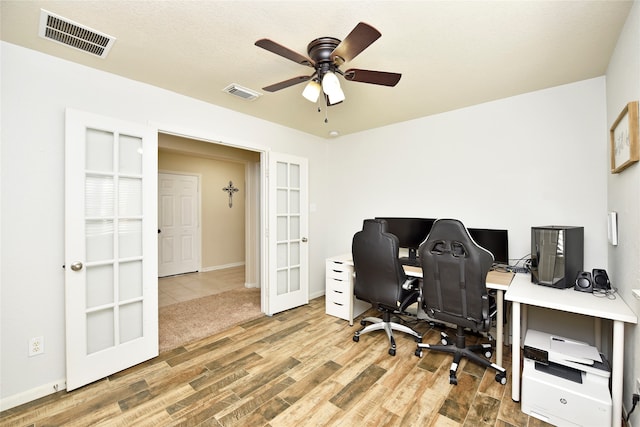 office with ceiling fan, french doors, and hardwood / wood-style flooring