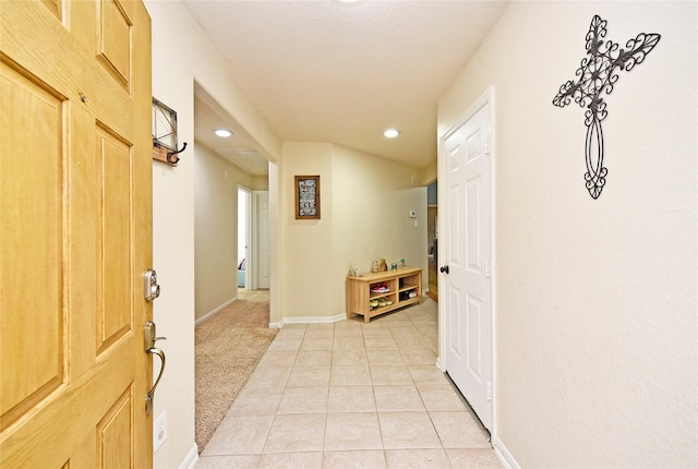 corridor featuring light tile patterned flooring