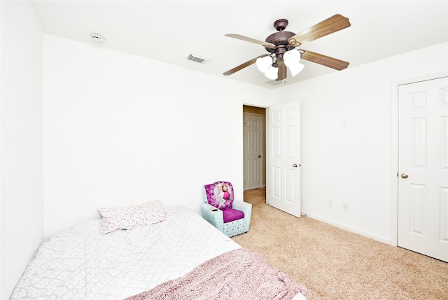 bedroom featuring ceiling fan and light colored carpet