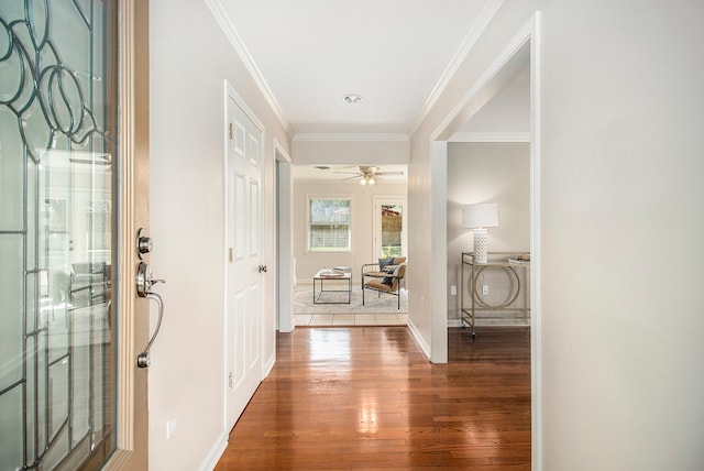 interior space with hardwood / wood-style floors and crown molding