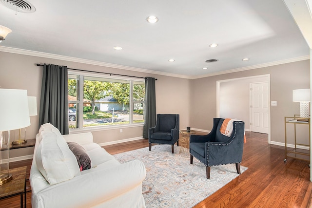 living room featuring dark hardwood / wood-style flooring and crown molding