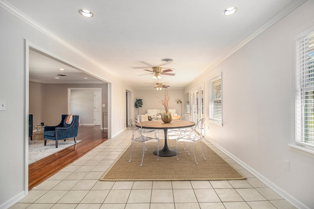 dining area featuring light hardwood / wood-style floors, ceiling fan, and crown molding